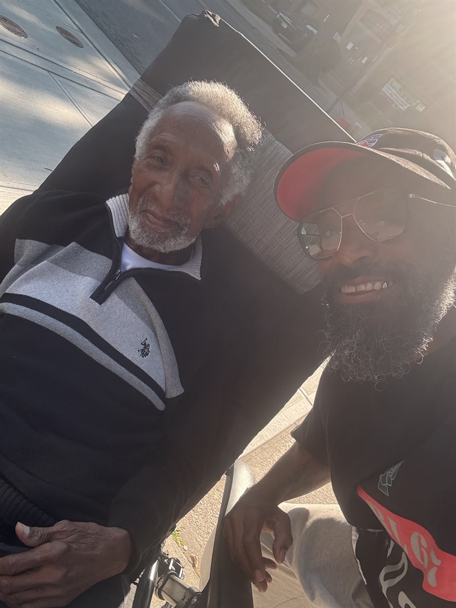 Prance with an older neighbor sitting out on the block