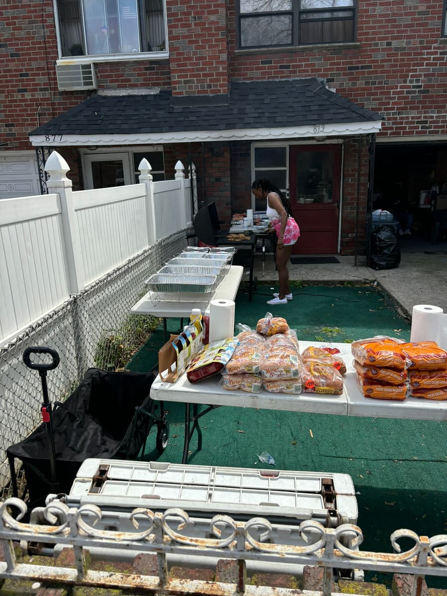 Tables of free food and rolls set out for the block