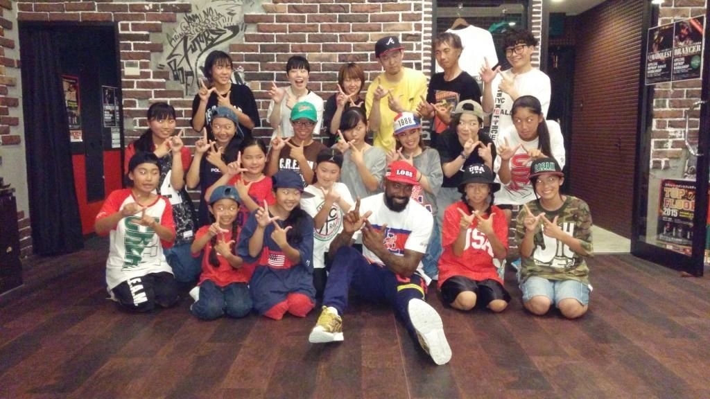 Prance with a full class of young dancers at the end of a hip-hop dance session